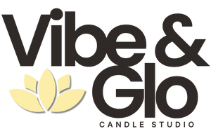 Vibe & Glo Candle Studio logo with modern black typography and a soft yellow lotus flower beneath “Vibe,” symbolizing mental health, healing, and personal growth.