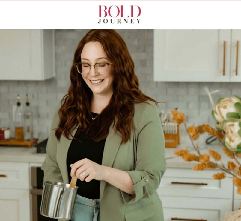 Founder of Vibe & Glo Candle Studio stirring candle wax in a modern kitchen studio, featured in Bold Journey January 2026.