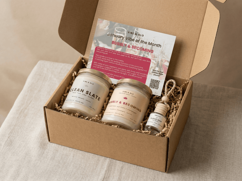 Candle of the month subscription box from Vibe & Glo featuring Clean Slate and Bubbly & Becoming candles with a car diffuser.