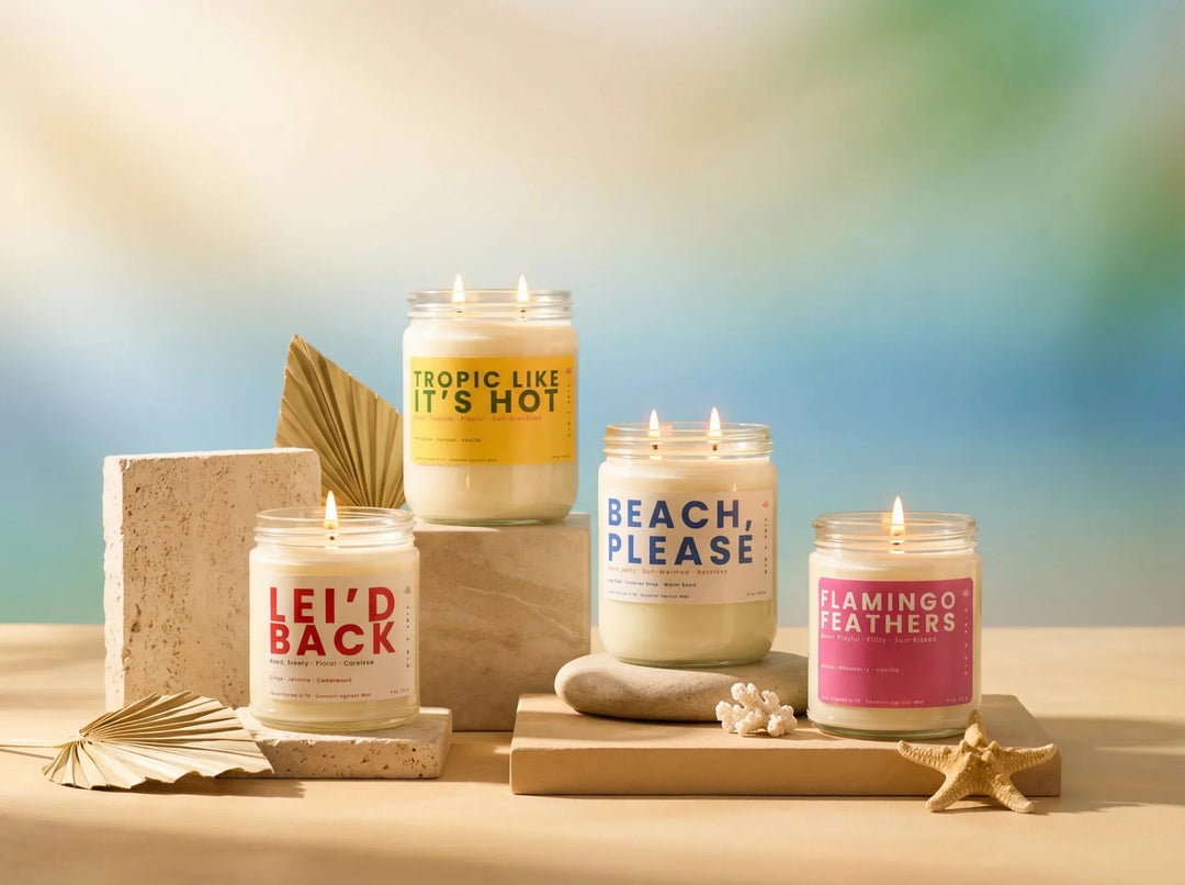 Summer candle collection featuring beachy, tropical, fruity, and floral scents styled on neutral risers with a soft colorful background