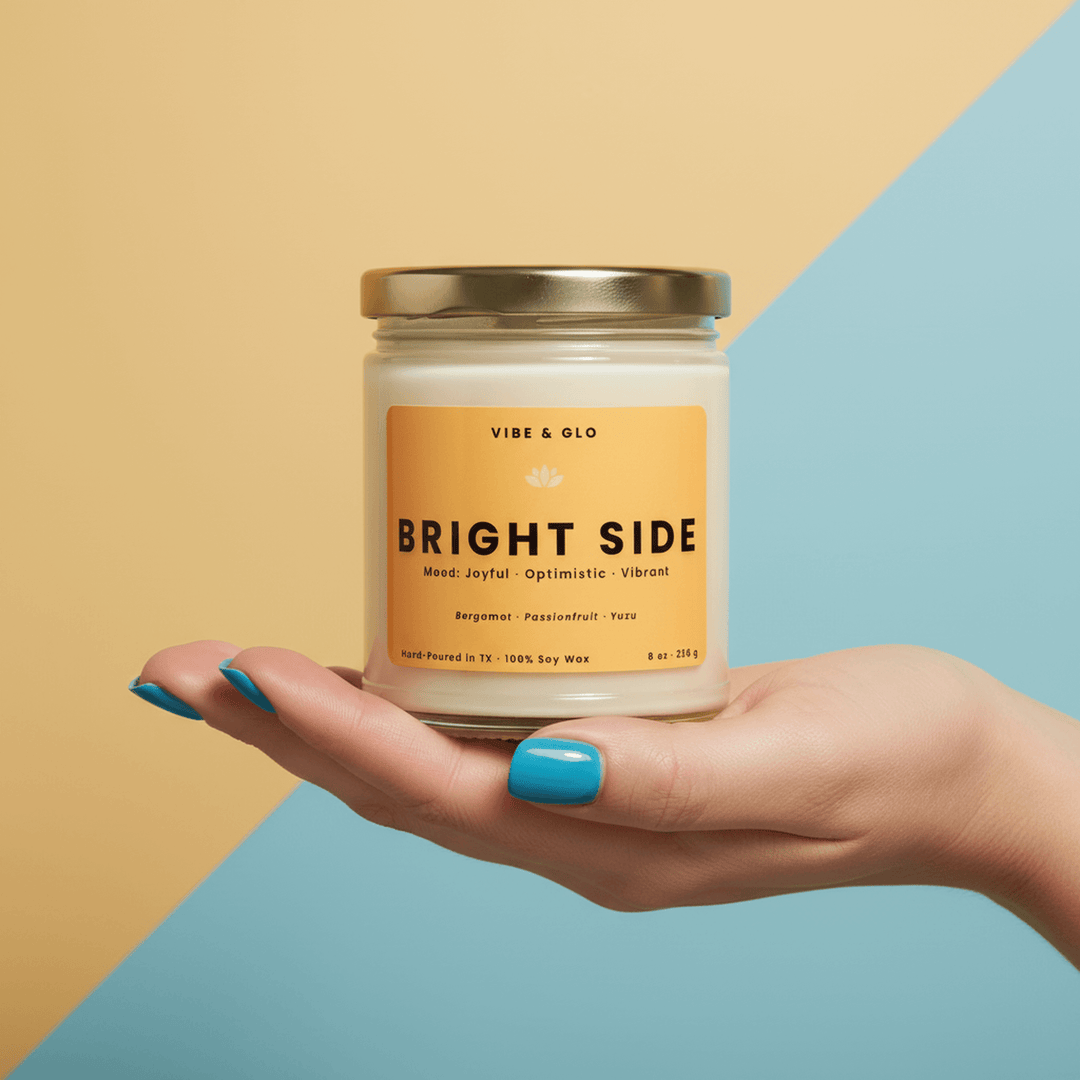 Hand holding a candle from Vibe & Glo labeled 'Bright Side' to emphasize mental health gift ideas.