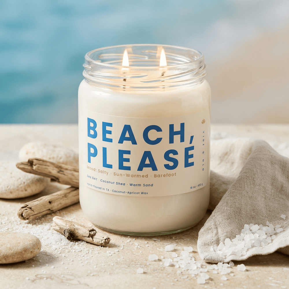 Beach Please 2-wick candle styled with sea salt crystals, stones, and driftwood creating a relaxing coastal spa vibe