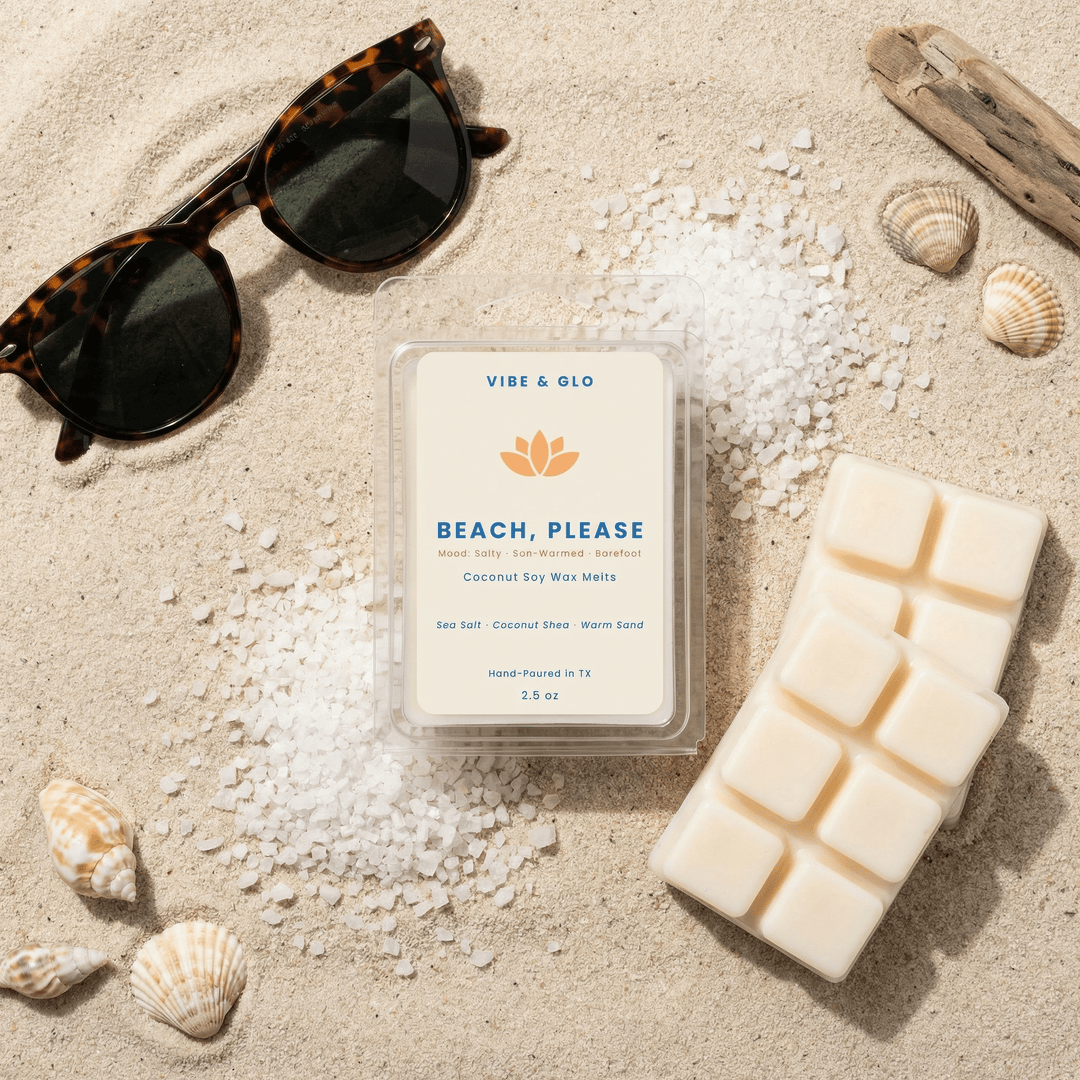 Beach Please wax melts styled with sunglasses, sea salt crystals, and sand for a beach day aesthetic