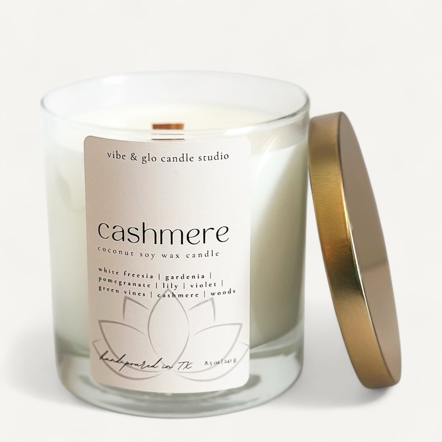 Cashmere coconut soy wax candle by Vibe and Glo with gold lid and clean label design.