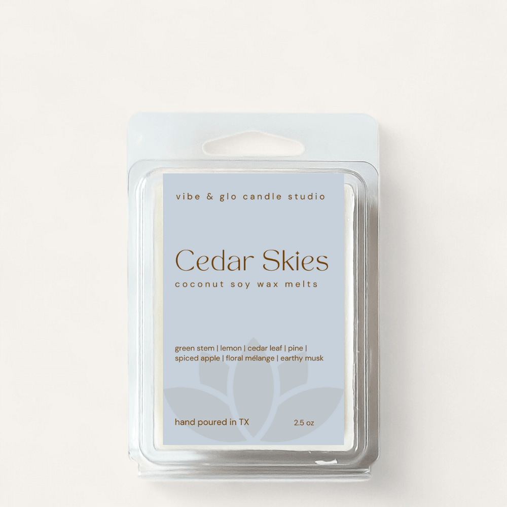 Cedar Skies coconut soy wax melts packaging featuring green stem, apple, and earthy musk scents.