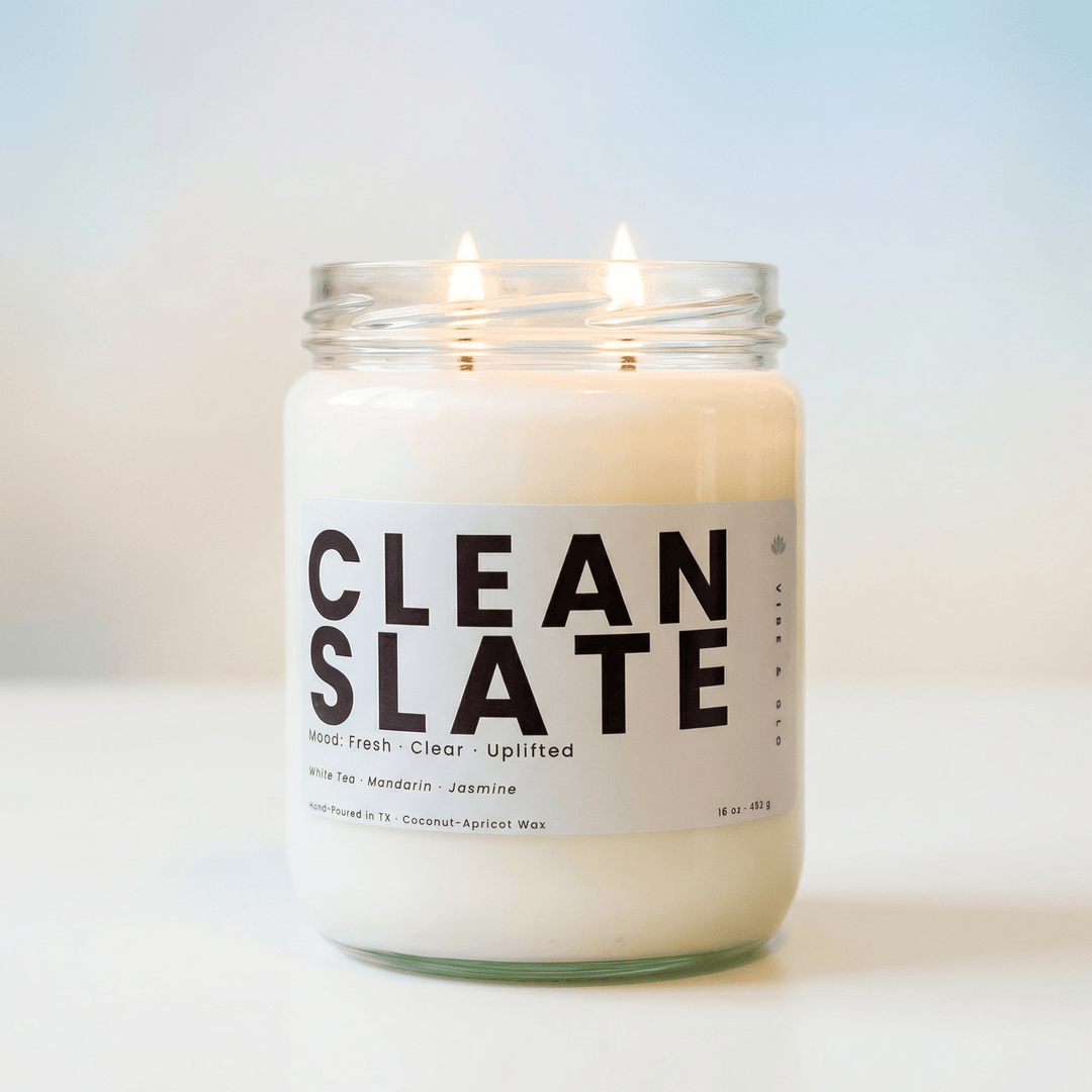 Clean Slate 2-wick candle with soft neutral background, clean fresh candle with white tea, mandarin, and jasmine
