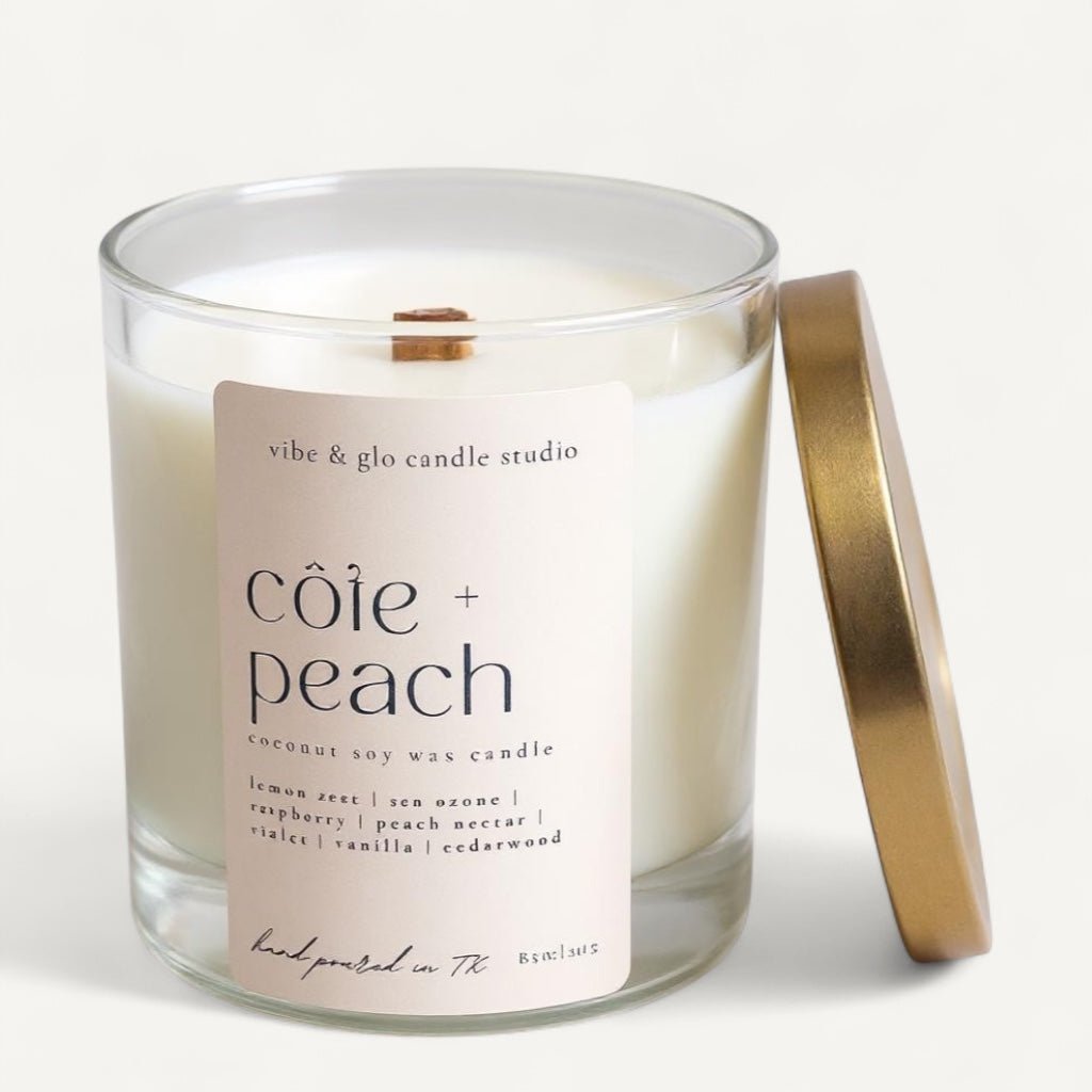 Vibe & Glo Côte + Peach coconut soy candle with lemon zest, sea ozone, raspberry, peach nectar, violet, vanilla, and cedarwood fragrance blend.