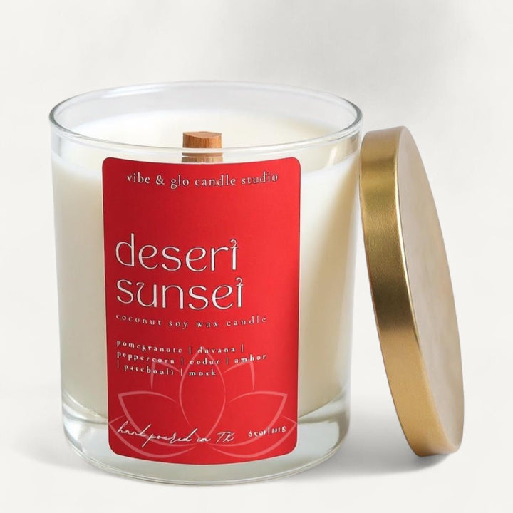 Desert Sunset candle by Vibe and Glo with warm amber scent and bold red label.