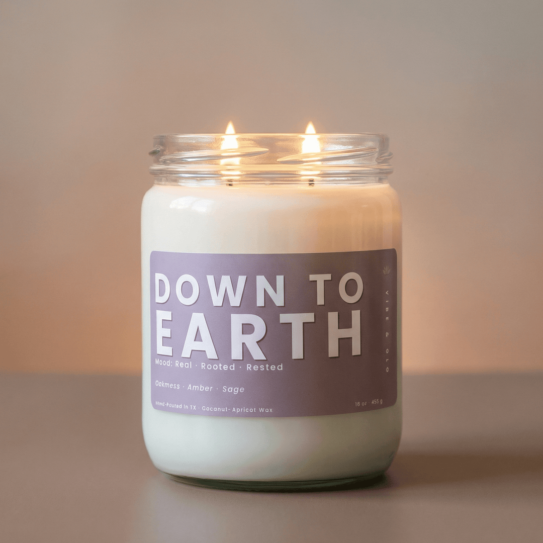 Down to Earth 2-wick candle with two cotton wicks on a soft neutral background, clean modern product image