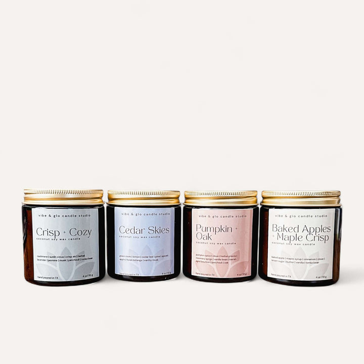 Fall Candle Flight from Vibe & Glo, 4-piece fall candle discovery set with seasonal scents in amber jars.