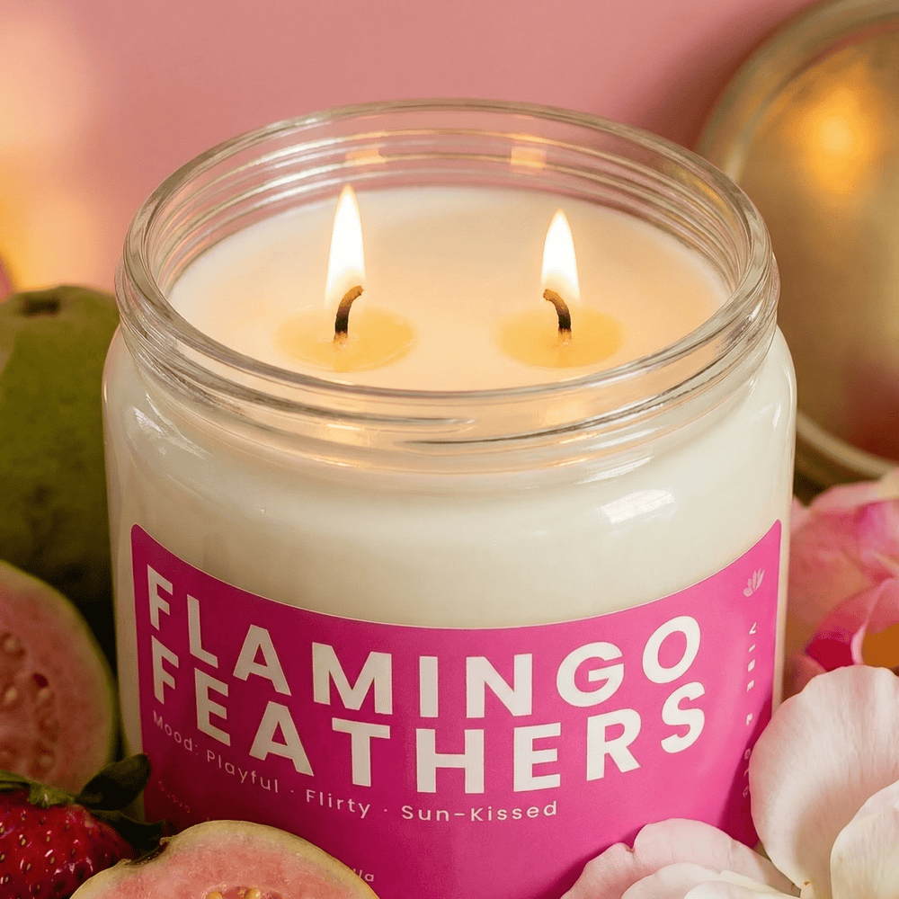 Flamingo Feathers double wick candle close-up with guava and strawberry showing fruity scented candle details