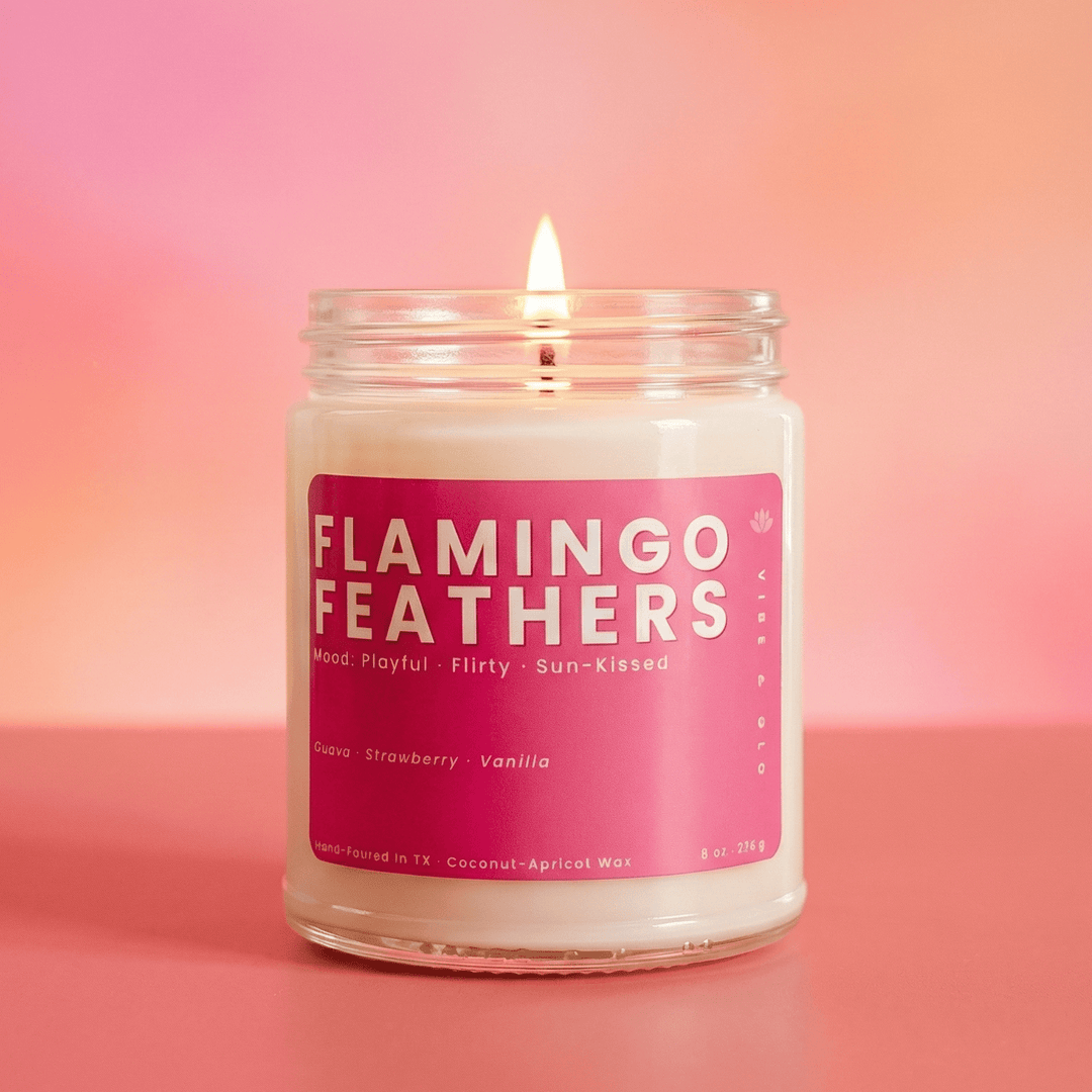Flamingo Feathers fruity jar candle with guava strawberry scent on a soft pink background