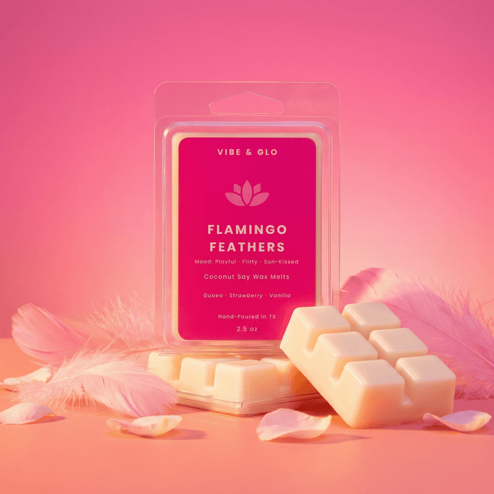 Flamingo Feathers wax melts on pink background with soft feathers and warm lighting
