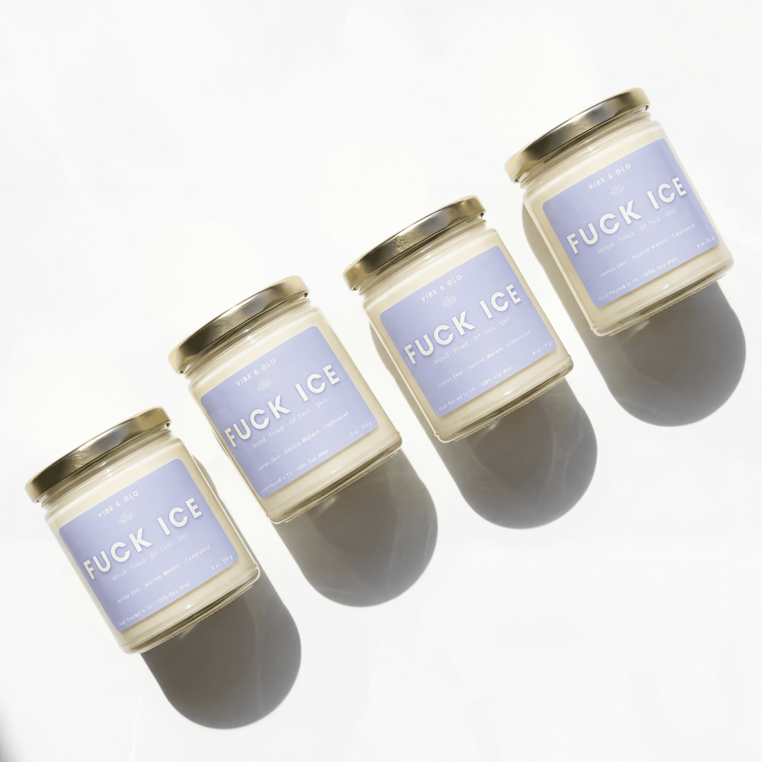 Four candles with 'F*CK ICE' labels on a white background