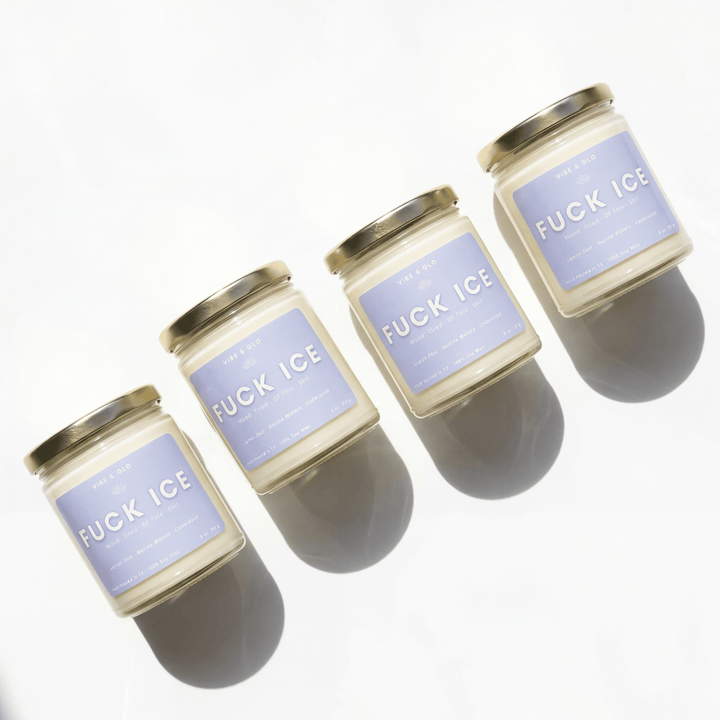 Four candles with 'F*CK ICE' labels on a white background