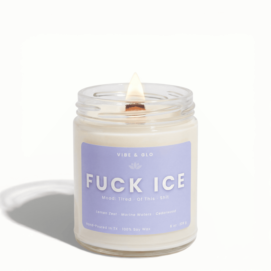 Fuck ICE soy candle by Vibe & Glo Candle Studio on a white background with a lit wooden wick