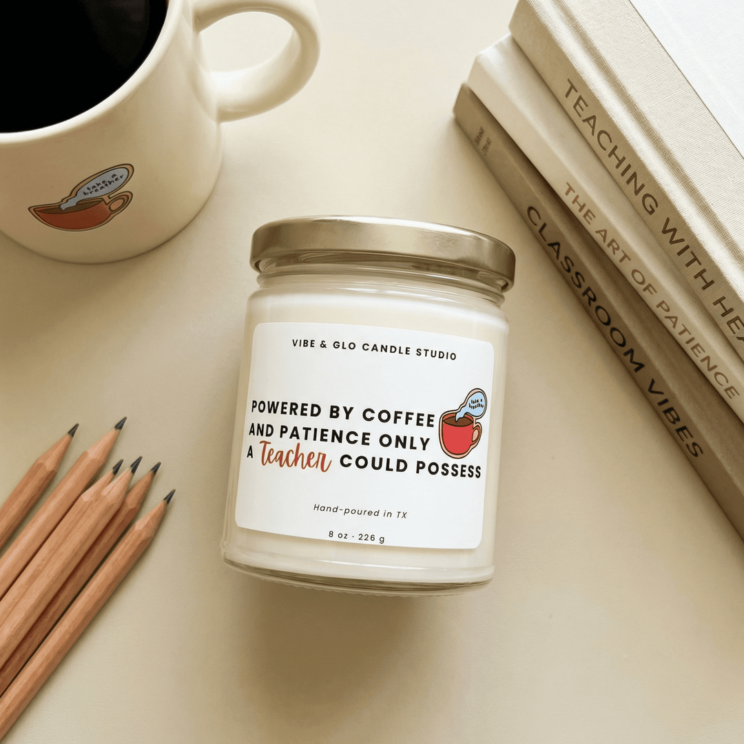 Funny teacher gift candle "Powered by Coffee and Patience Only a Teacher Could Possess" in 8 oz soy jar styled with pencils, books, and coffee mug