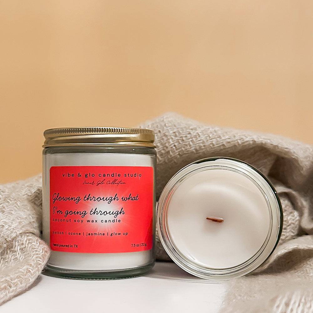 Glowing through what I’m going through coconut soy wax candle with cotton, ozone, and jasmine. Styled with a beige blanket for a cozy, comforting feel.