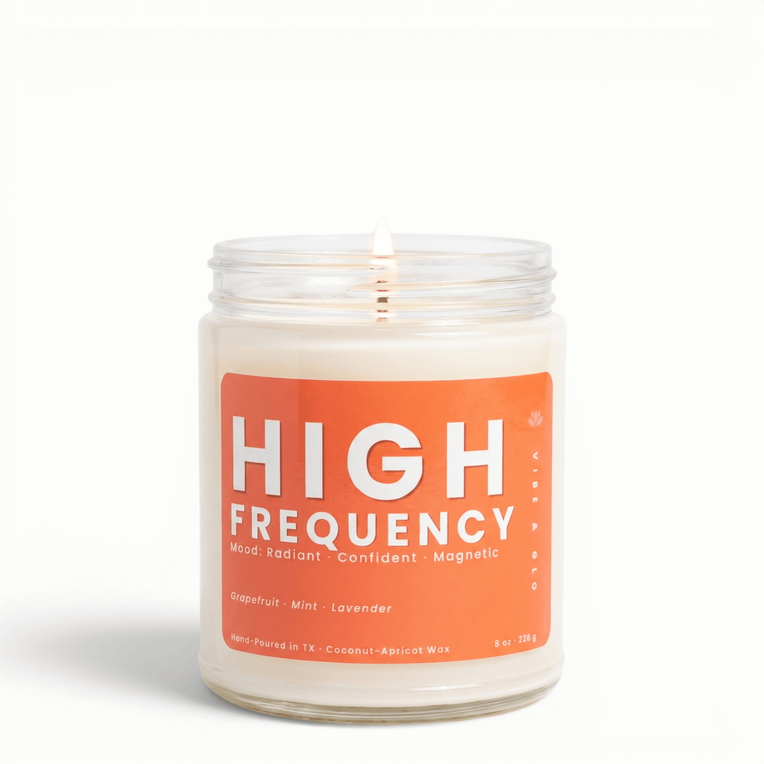 High Frequency grapefruit mint lavender candle in clear glass jar with lit cotton wick, clean burning coconut apricot wax scented candle for energy and focus