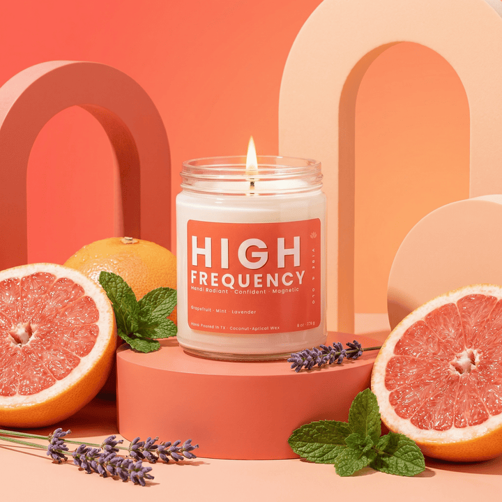 High Frequency candle with grapefruit mint and lavender in a modern citrus inspired home decor scene