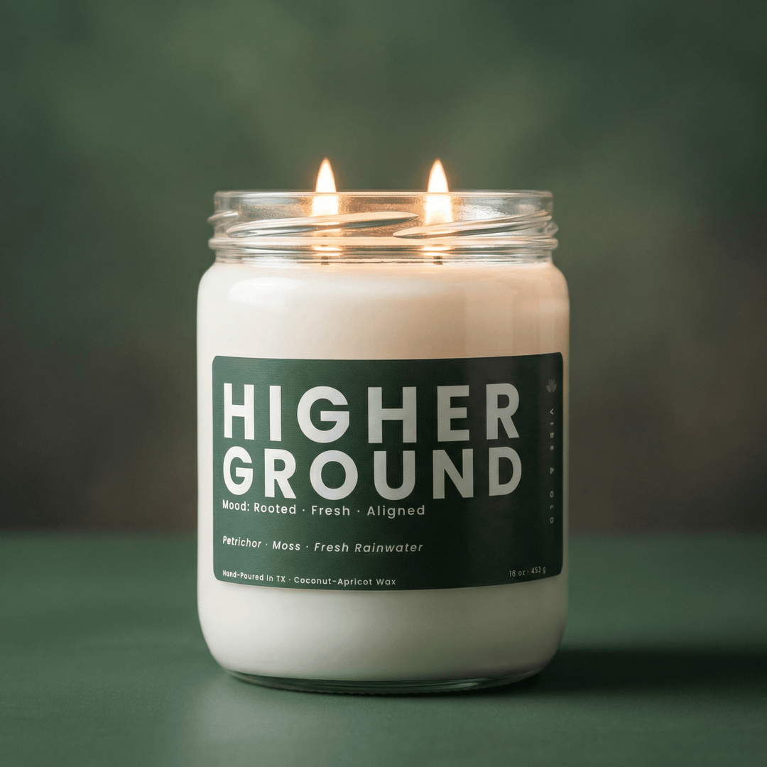 Higher Ground 2-wick candle with soft green background, fresh clean candle with petrichor, moss, and rainwater notes