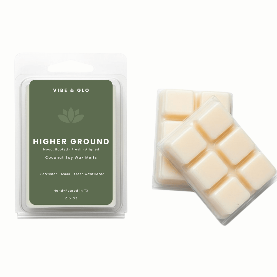 Higher Ground coconut soy wax melts by Vibe & Glo with petrichor, moss, and fresh rainwater in a clean, non-toxic 2.5 oz clamshell.