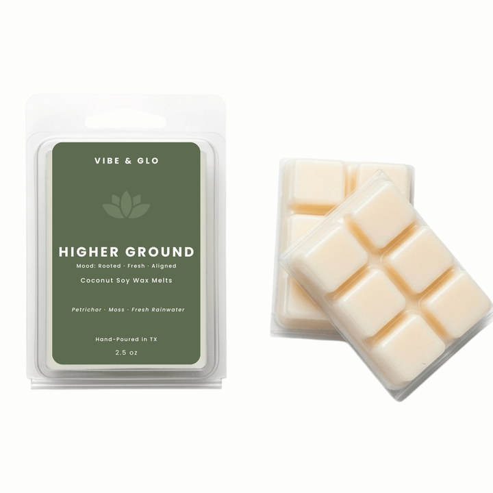 Higher Ground coconut soy wax melts by Vibe & Glo with petrichor, moss, and fresh rainwater in a clean, non-toxic 2.5 oz clamshell.