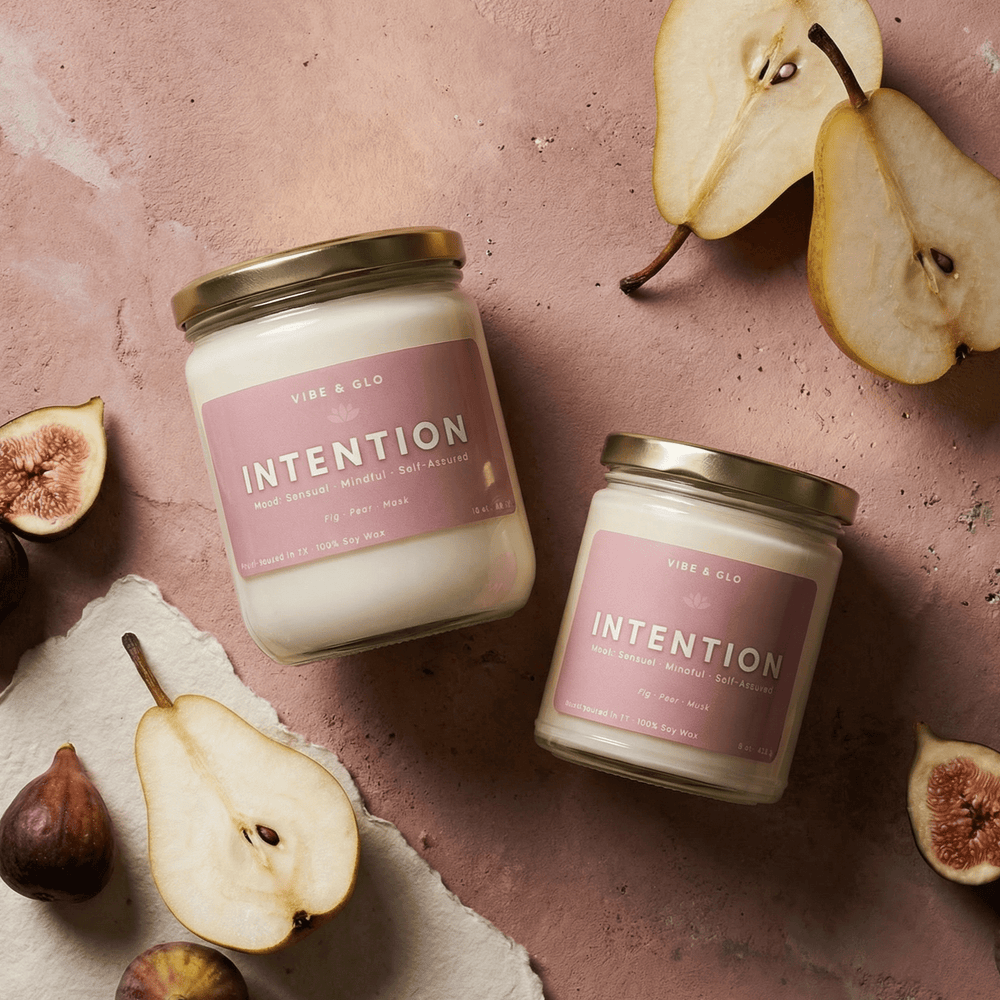 Intention wooden wick soy candle in 16 oz and 8 oz jars styled with pears and figs, featuring fig, pear, and musk notes.