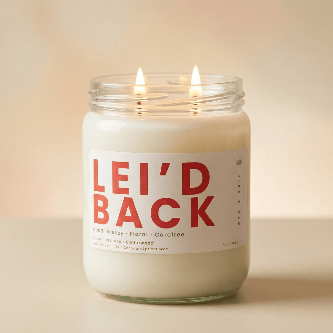 Lei’d Back 2-wick candle with double cotton wicks on a clean neutral background minimal tropical floral product image
