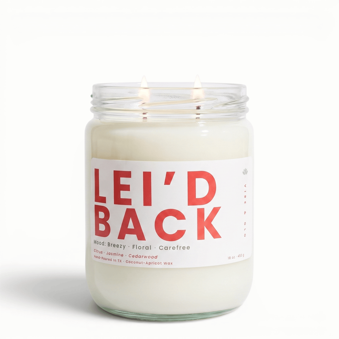 Leid Back 2 wick candle with jasmine coconut and cedarwood in glass jar, breezy tropical coconut apricot wax candle for a carefree vibe