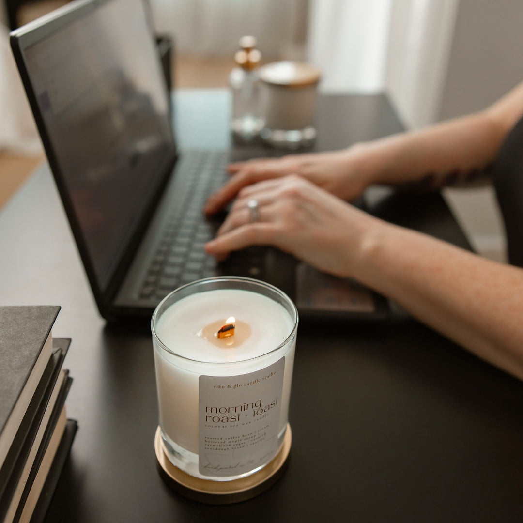 Cozy workspace with Morning Roast + Toast candle, enhancing the aroma of coffee and toasted vanilla.