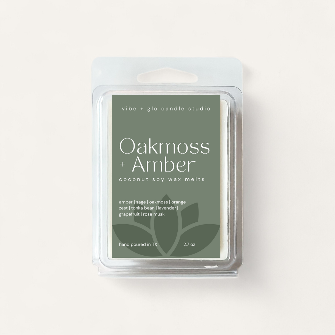 Oakmoss + Amber coconut soy wax melts package featuring earthy scents and ingredient list.