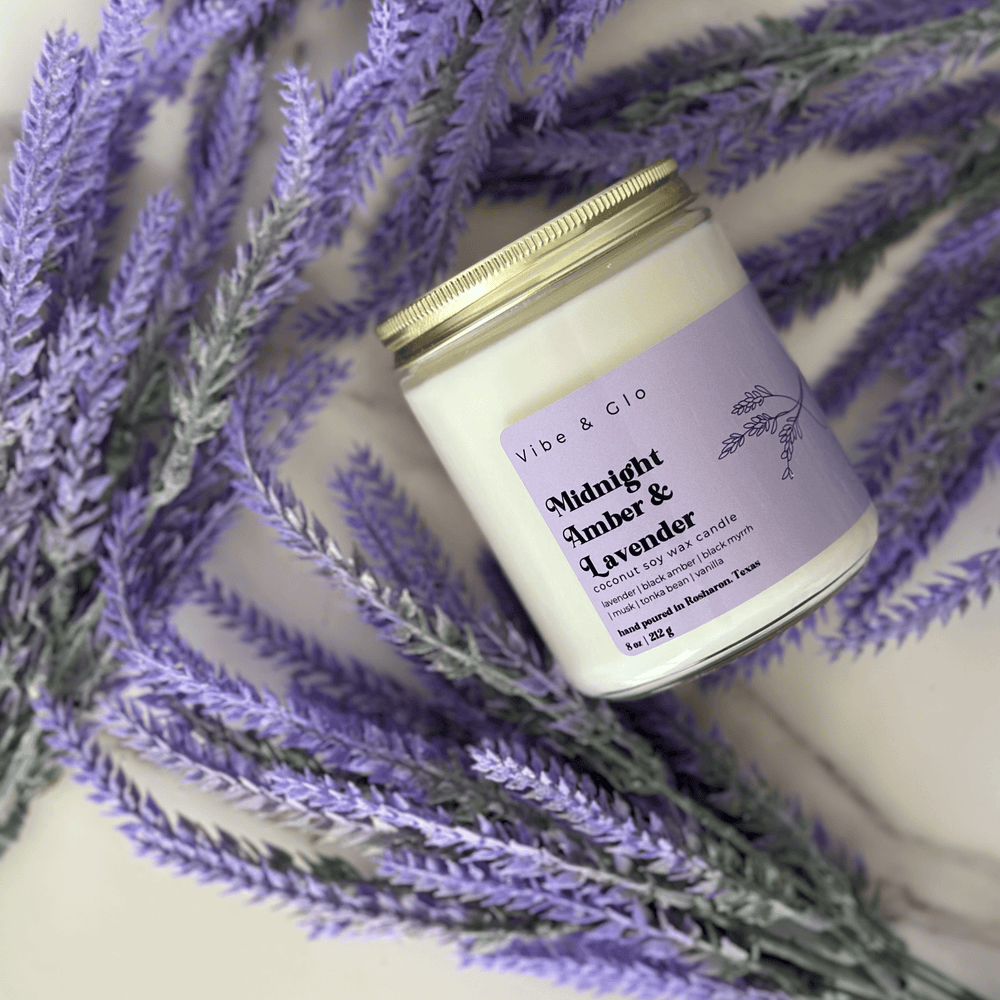 
                  
                    Overhead view of the Midnight Amber & Lavender candle surrounded by lavender flowers, highlighting its minimalist and calming aesthetic.
                  
                