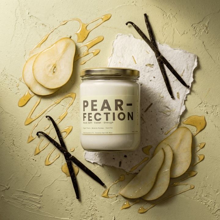 Pear-Fection candle flat lay with pear slices, vanilla beans, and honey drizzle, sweet fruity candle with warm vanilla notes