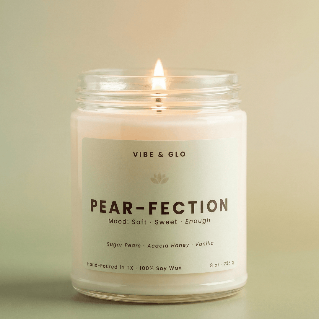 Pear-Fection soy candle with sweet pear honey and vanilla scent in a clean glass jar with soft green aesthetic background