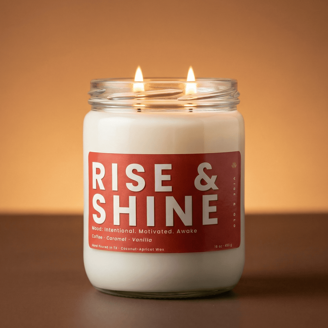 Rise and Shine 2-wick candle glowing on warm background, coffee caramel vanilla scented candle for cozy mornings