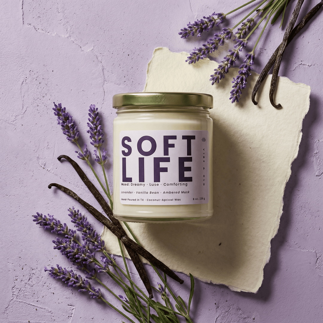 Soft Life candle styled with fresh lavender and vanilla beans highlighting a dreamy comforting lavender vanilla home fragrance