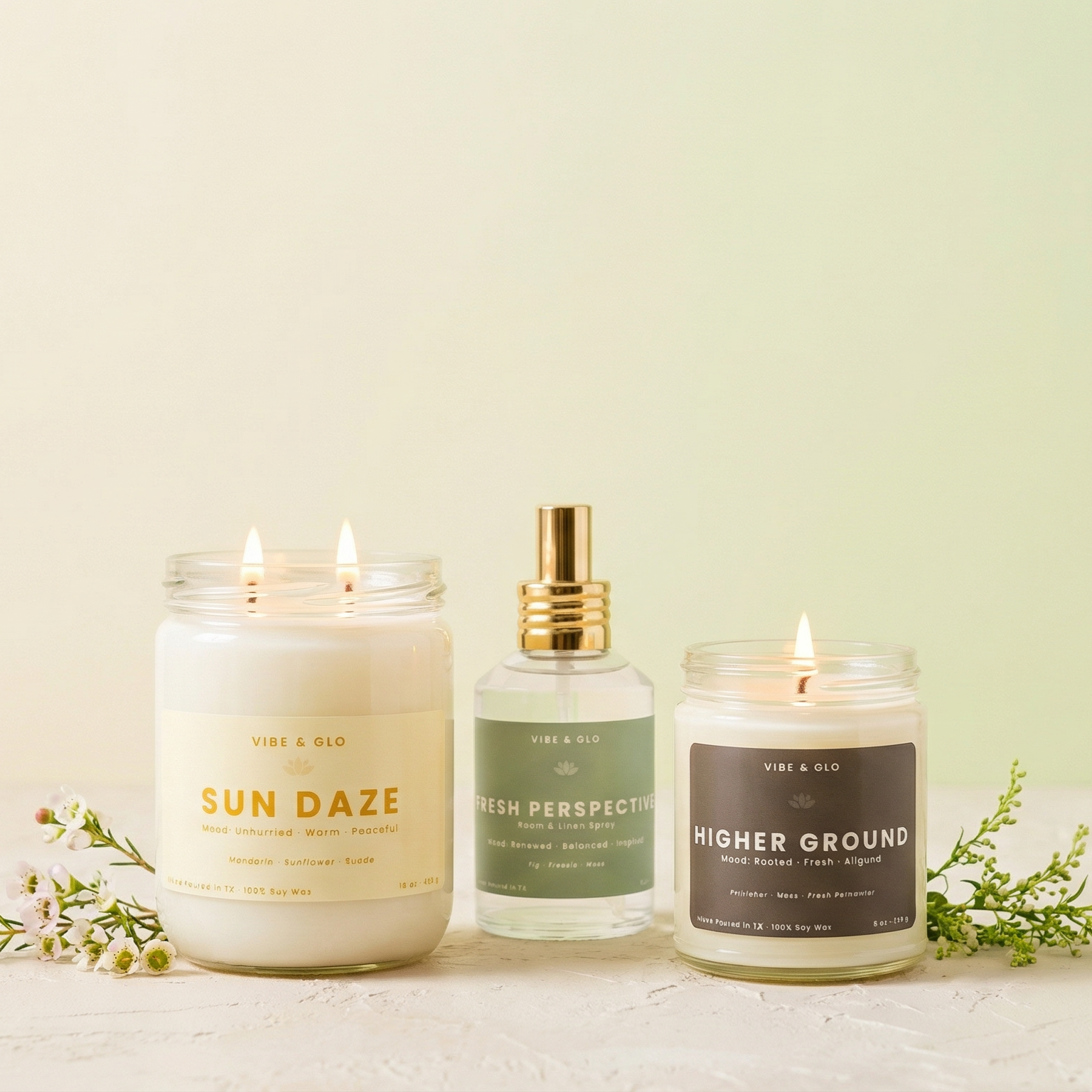 Vibe & Glo Spring soy candle collection featuring Sun Daze citrus candle, Fresh Perspective room spray, and Higher Ground clean-burning spring home fragrance.
