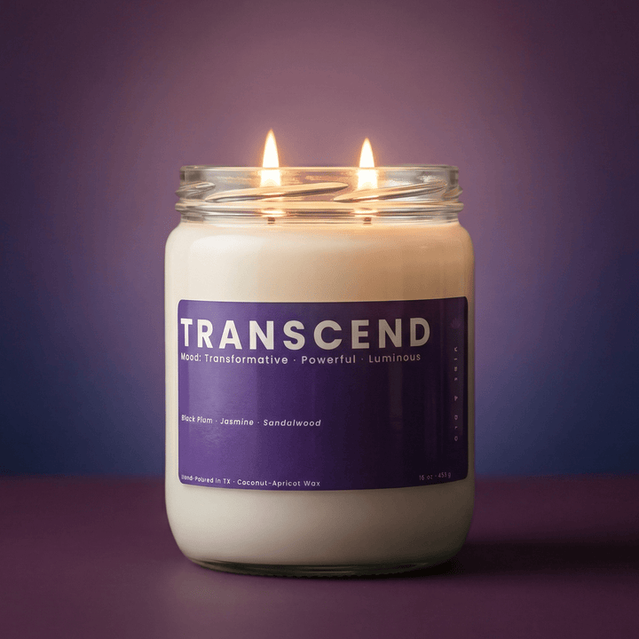Transcend 2-wick candle with two cotton wicks on a purple gradient background, clean modern product hero image