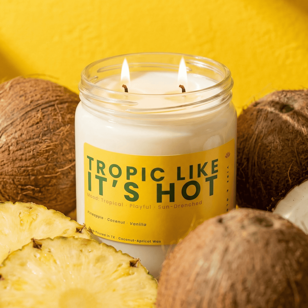 Tropic Like It’s Hot 2 wick candle with pineapple and coconut showcasing tropical scented candle in bright yellow setting