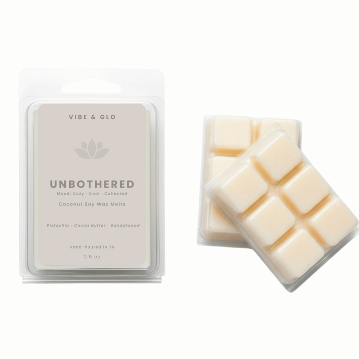 Unbothered coconut soy wax melts by Vibe & Glo featuring pistachio, cocoa butter, and sandalwood in a 2.5 oz clamshell with six wax cubes.