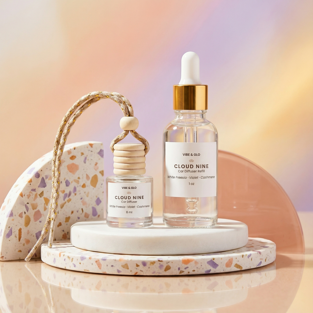 Vibe & Glo hanging car diffuser and matching refill bottle styled together in a colorful, modern lifestyle scene with visible fragrance oil