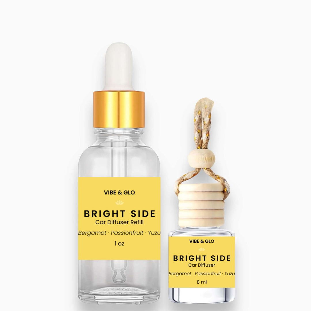 Vibe & Glo car diffuser refill bottles with yellow labels on a white background