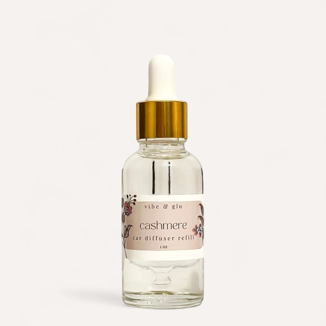 1 oz dropper bottle of Cashmere car diffuser refill by Vibe & Glo, perfect for extending car fragrance.