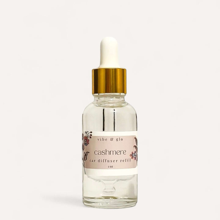 1 oz dropper bottle of Cashmere car diffuser refill by Vibe & Glo, perfect for extending car fragrance.