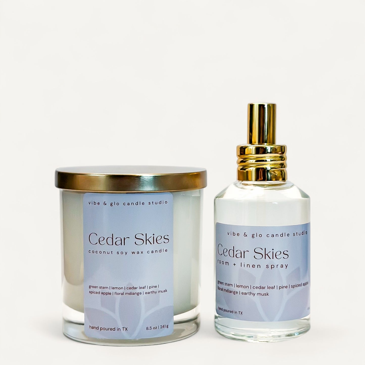 Cedar Skies bundle with coconut soy candle and room linen spray in elegant glass containers.