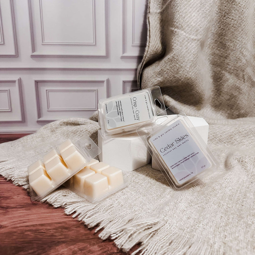 Cedar Skies wax melts on a textured surface with a neutral background