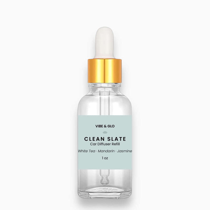 Clear bottle with gold cap labeled 'Vibe & Glo Clean Slate' on a white background