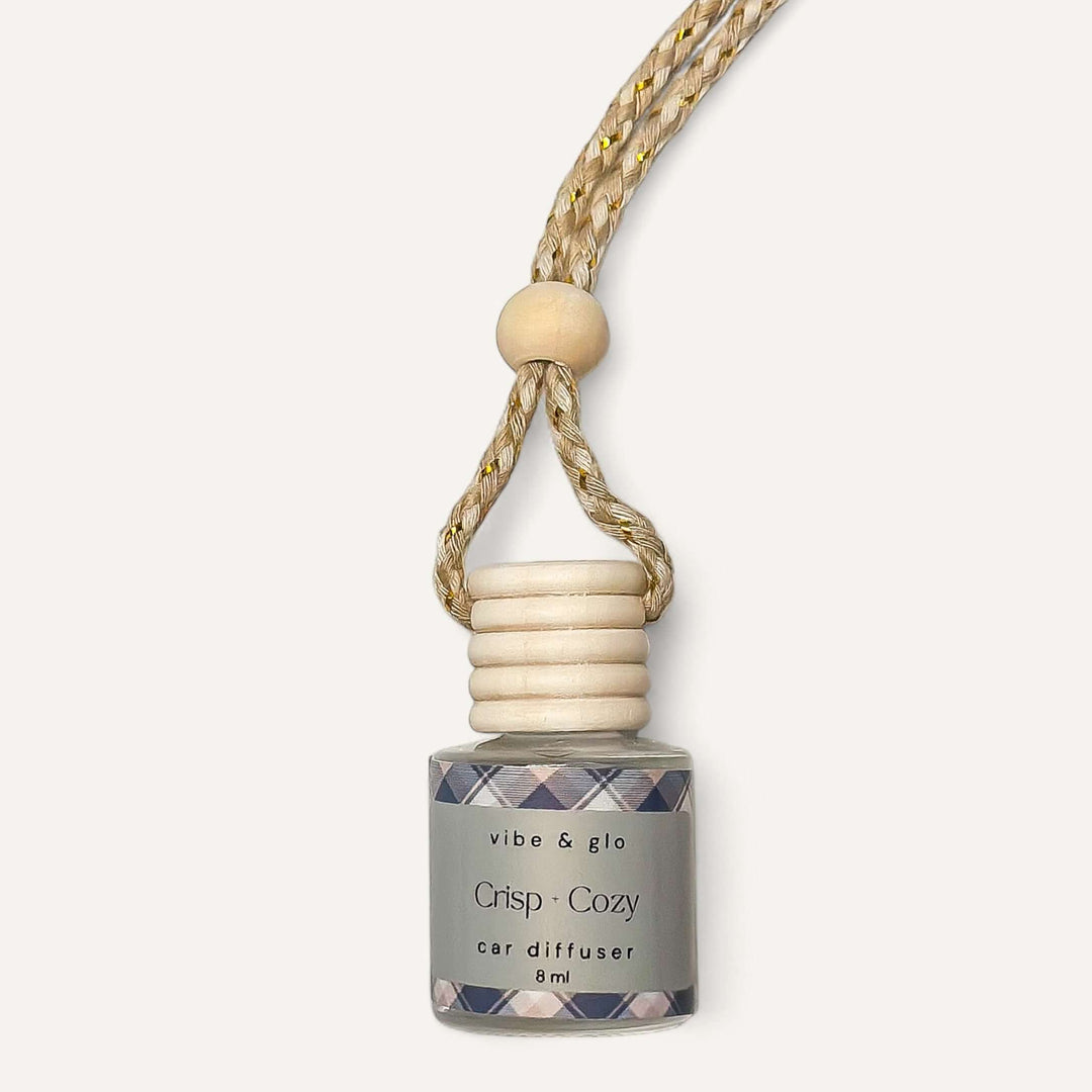 Crisp Cozy fall car diffuser by vibe & glo, featuring a wooden top and braided cord, perfect for autumn scents.