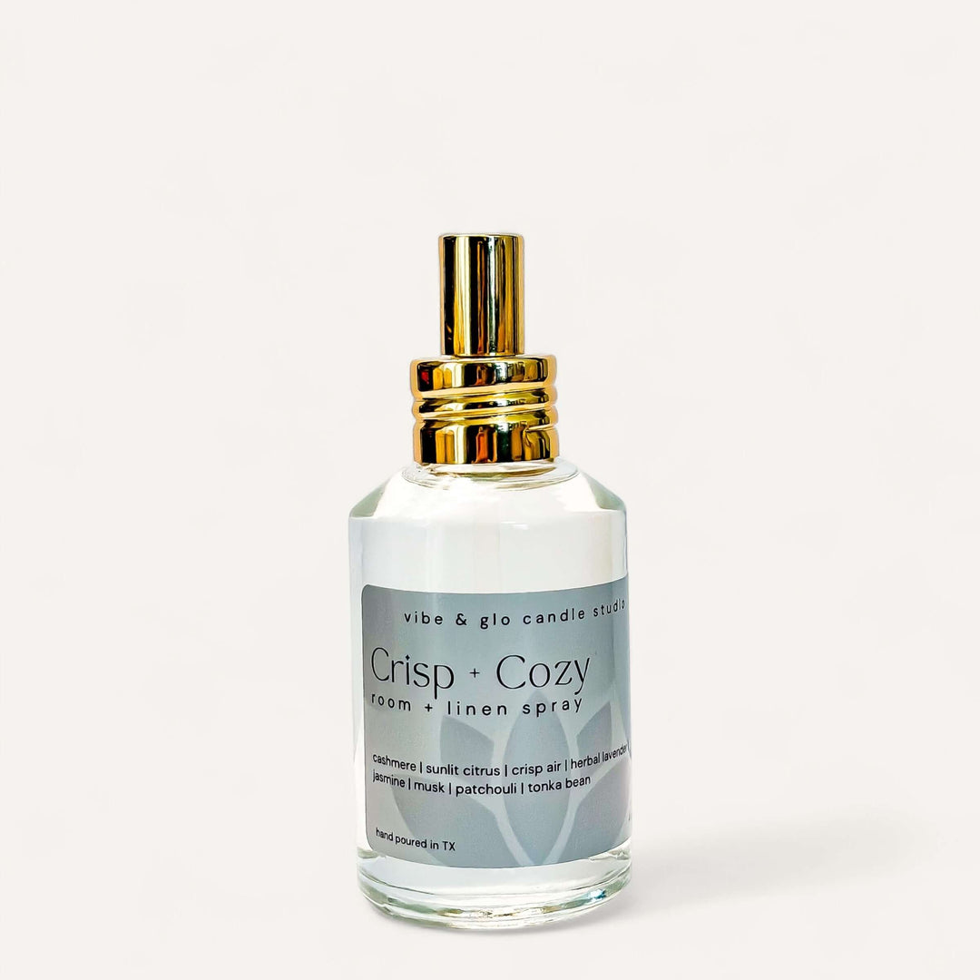 Crisp + Cozy Room & Linen Spray bottle featuring cashmere, citrus, and lavender fragrance.